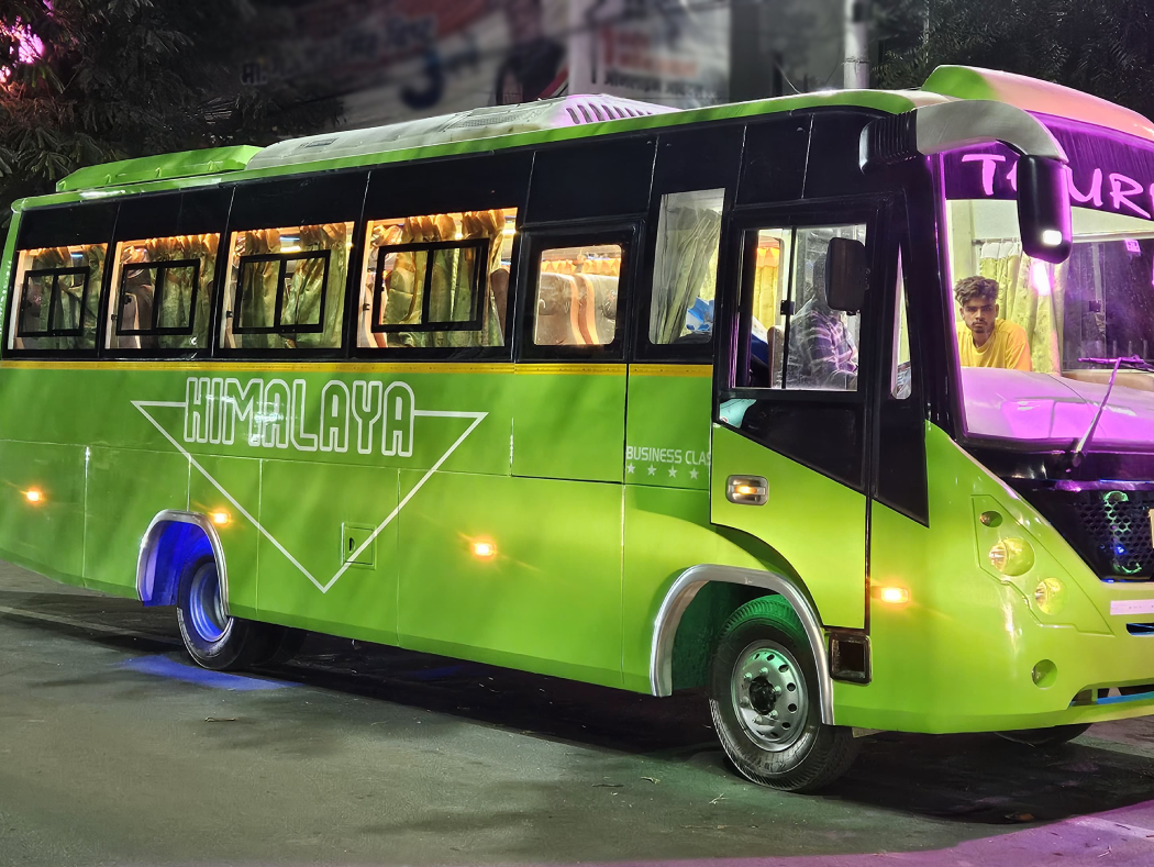 tiwari travel - green bus with himalaya written on it at front and sides